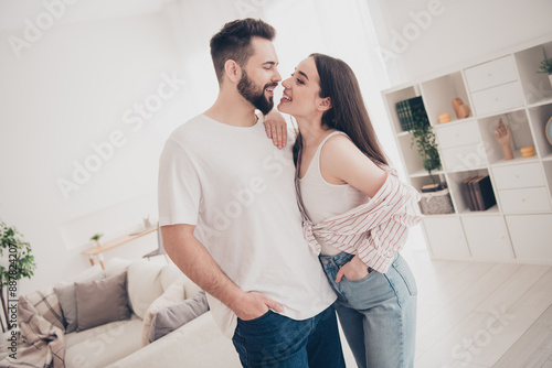 Photo of attractive trendy cheerful married young couple spending free time tenderness move new apartment home interior indoors #887824207