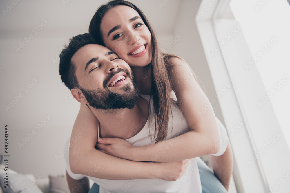 Photo of dreamy good mood couple dressed casual clothes riding back relaxing home indoors house apartment room Photo of dreamy good mood couple dressed casual clothes riding back relaxing home indoors house apartment room