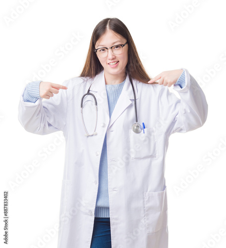 Young Chinese doctor woman over isolated background looking confident with smile on face, pointing oneself with fingers proud and happy.