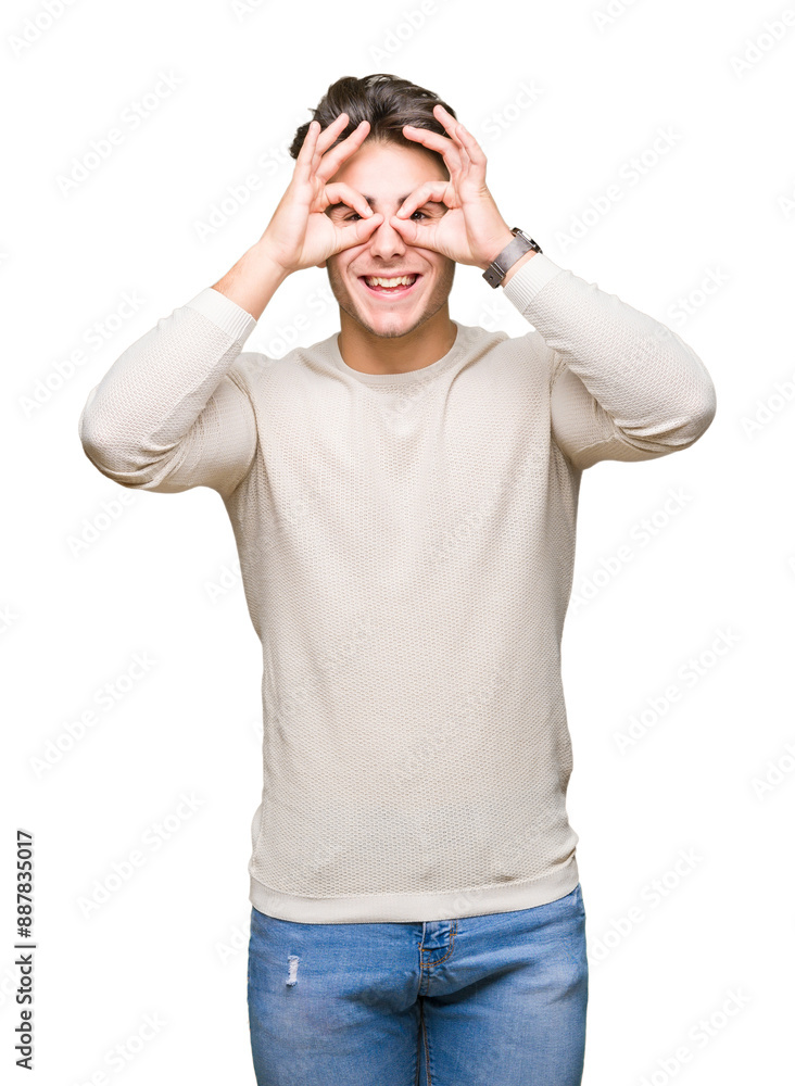Young handsome man over isolated background doing ok gesture like binoculars sticking tongue out, eyes looking through fingers. Crazy expression. Young handsome man over isolated background doing ok gesture like binoculars sticking tongue out, eyes looking through fingers. Crazy expression.