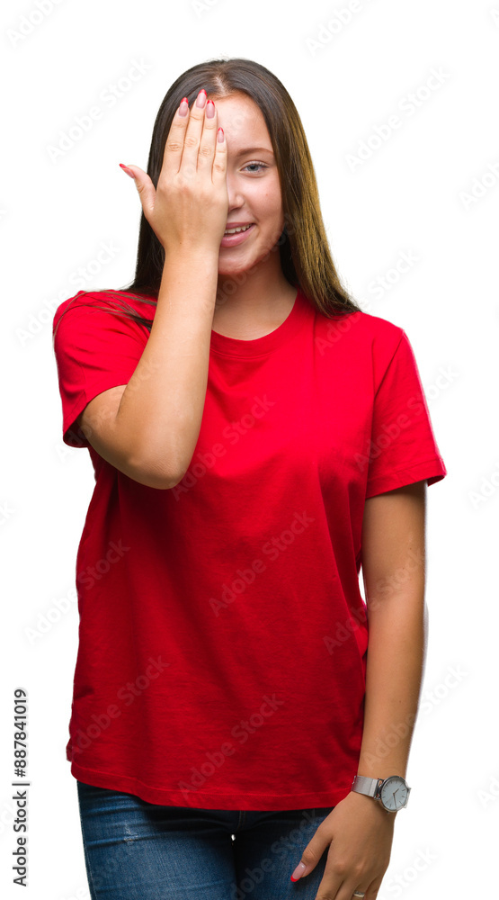 Young beautiful caucasian woman over isolated background covering one eye with hand with confident smile on face and surprise emotion. Young beautiful caucasian woman over isolated background covering one eye with hand with confident smile on face and surprise emotion.