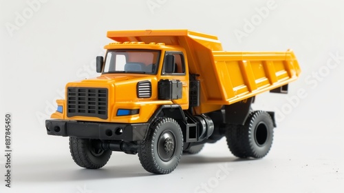 plastic toy dump truck, yellow and black colors and playful design isolated on white background. 