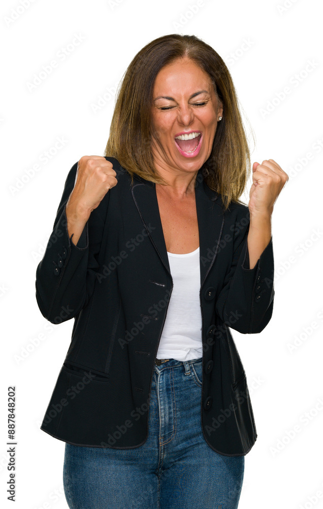 Beautiful middle age business adult woman over isolated background very happy and excited doing winner gesture with arms raised, smiling and screaming for success. Celebration concept. Beautiful middle age business adult woman over isolated background very happy and excited doing winner gesture with arms raised, smiling and screaming for success. Celebration concept.