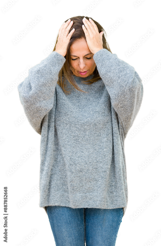 Beautiful middle age woman wearing winter sweater over isolated background suffering from headache desperate and stressed because pain and migraine. Hands on head. Beautiful middle age woman wearing winter sweater over isolated background suffering from headache desperate and stressed because pain and migraine. Hands on head.