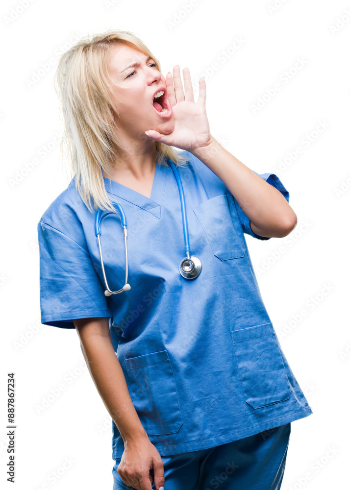 Young beautiful blonde doctor woman wearing medical uniform over isolated background shouting and screaming loud to side with hand on mouth. Communication concept. Young beautiful blonde doctor woman wearing medical uniform over isolated background shouting and screaming loud to side with hand on mouth. Communication concept.