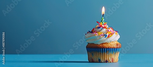 A birthday cupcake sits ato...