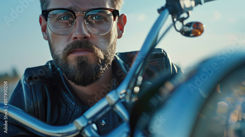 Cool Man in Glasses and Leather Jacket Riding Motorcycle