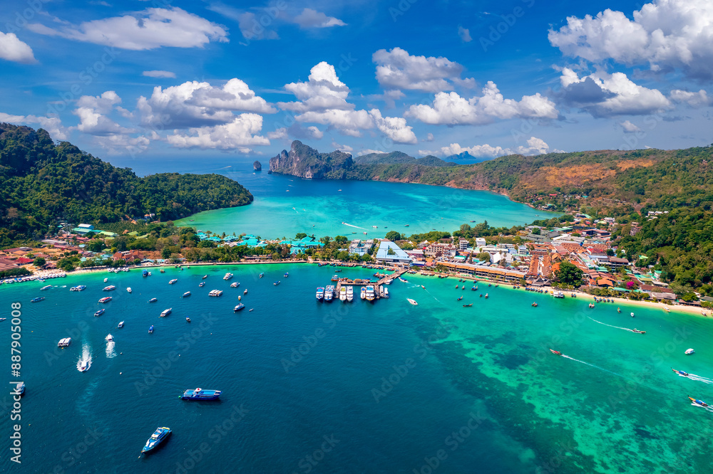 Island Phi Phi with longtail boat, turquoise clear water in Krabi Thailand. Amazing travel landscape photo in Thai Island Phi Phi with longtail boat, turquoise clear water in Krabi Thailand. Amazing travel landscape photo in Thai