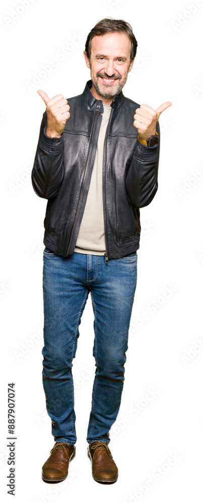 Obraz premium Middle age handsome man wearing black leather jacket success sign doing positive gesture with hand, thumbs up smiling and happy. Looking at the camera with cheerful expression, winner gesture.