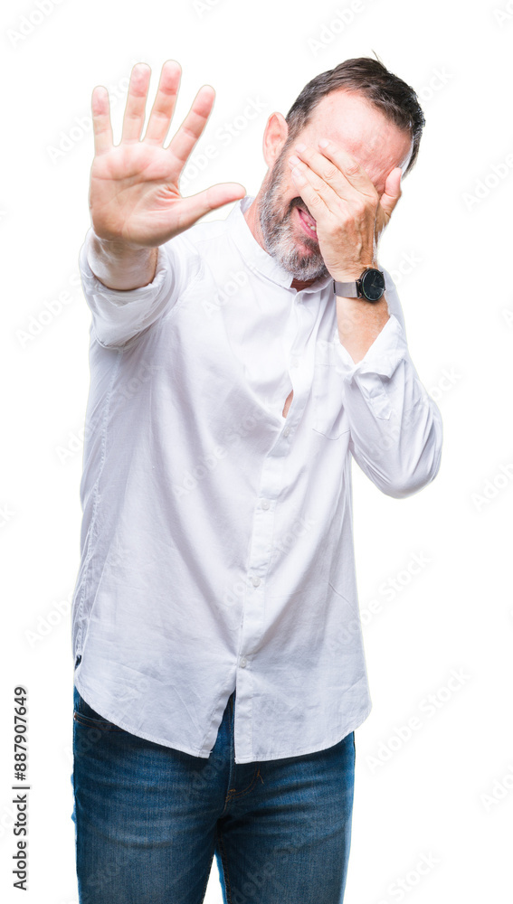 Middle age hoary senior man over isolated background covering eyes with hands and doing stop gesture with sad and fear expression. Embarrassed and negative concept. Middle age hoary senior man over isolated background covering eyes with hands and doing stop gesture with sad and fear expression. Embarrassed and negative concept.