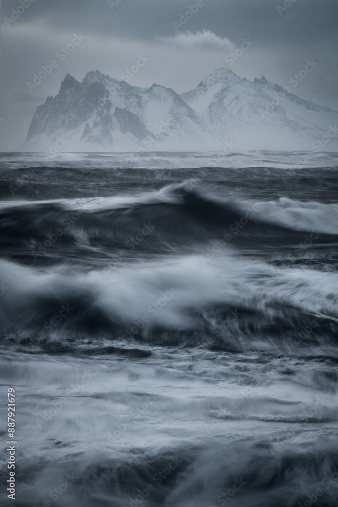 Artistic view from Eystrahorn to Vestrahorn mountain in Iceland, with motion in the waves on Atlantic Ocean Artistic view from Eystrahorn to Vestrahorn mountain in Iceland, with motion in the waves on Atlantic Ocean
