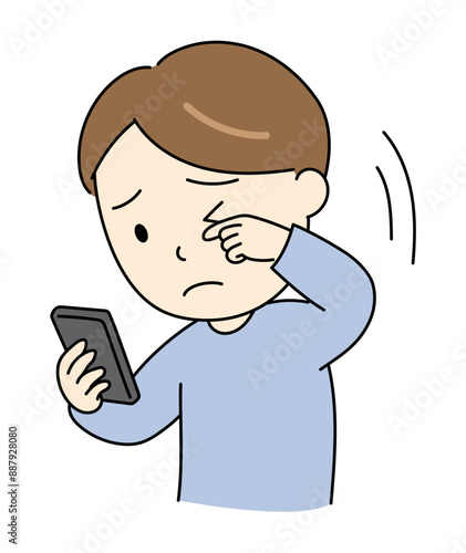 スマホ老眼で目が見えづらい若い男性