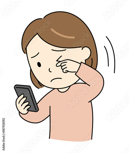 スマホ老眼で目が見えづらい若い女性