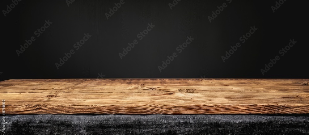 Black wooden table with a tablecloth focusing on the wooden surface with ample copy space image Black wooden table with a tablecloth focusing on the wooden surface with ample copy space image