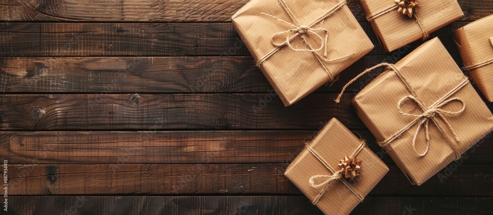 Fototapeta premium Gift boxes with decorative cords arranged on a wooden background perfect for a copy space image