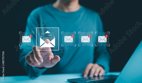 Email notification management concept. Checking digital email, A person with new email notification icons on a digital interface, email communication, messaging alerts, and online correspondence. photo