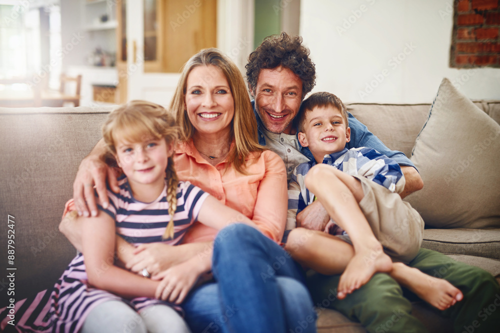 Happy, love and portrait of family on sofa in living room bonding and relaxing together at home. Weekend, smile and children sitting with parents for childhood memories on couch in the lounge Happy, love and portrait of family on sofa in living room bonding and relaxing together at home. Weekend, smile and children sitting with parents for childhood memories on couch in the lounge