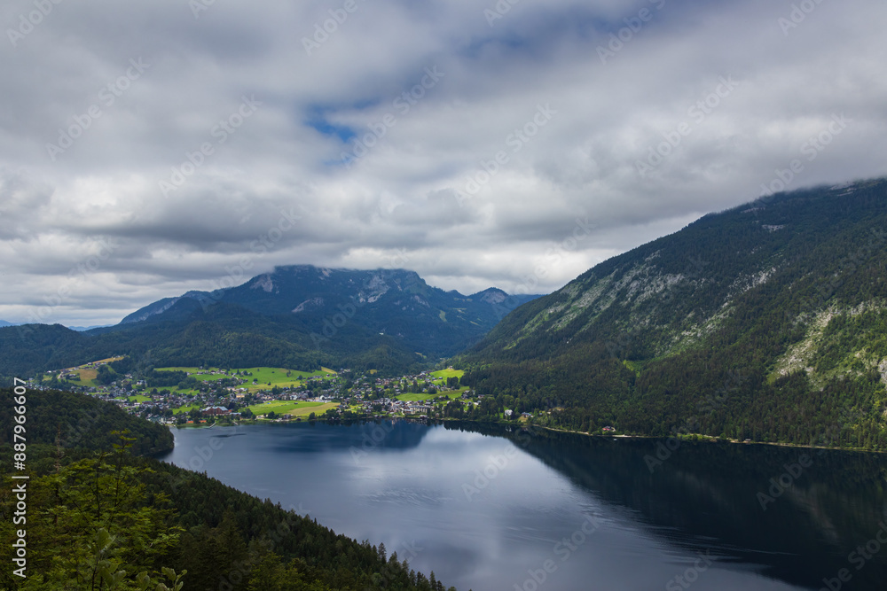 Alps mountain lake Altausee with village in valley at overcast weather. Travel lifestyle copy space background, Austria landscape Alps mountain lake Altausee with village in valley at overcast weather. Travel lifestyle copy space background, Austria landscape