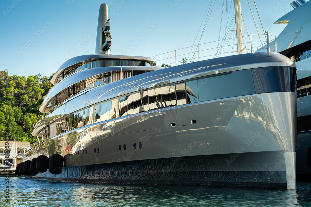 Naklejka premium Beautiful mega and superyachts at dock in English Harbour, a famous caribbean island of Antigua know for yacht season