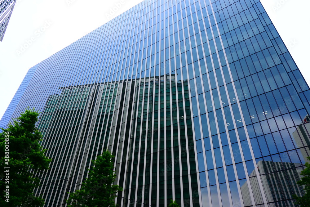 Skyscraper, mirrored windows, reflecting a building. Skyscraper, mirrored windows, reflecting a building.