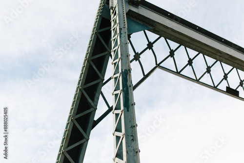 metal bridge with clouds in background photo