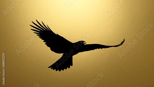 single falcon flying silhouette in gold background
