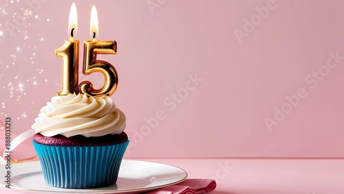 Gold Candle Number 15 on Blue Cupcake with Pink Background and Twinkling Lights
