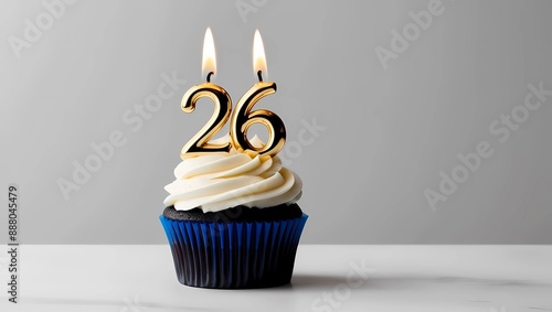 Gold Candle Number 26 on Blue Cupcake with Gray Background
