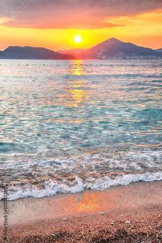 Obraz na płótnie Captivating sunset view of luxury beach near islet Sveti Stefan near Budva. w salonie