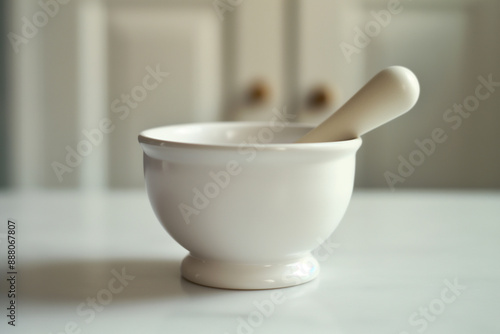 Sleek, golden pestle poised...