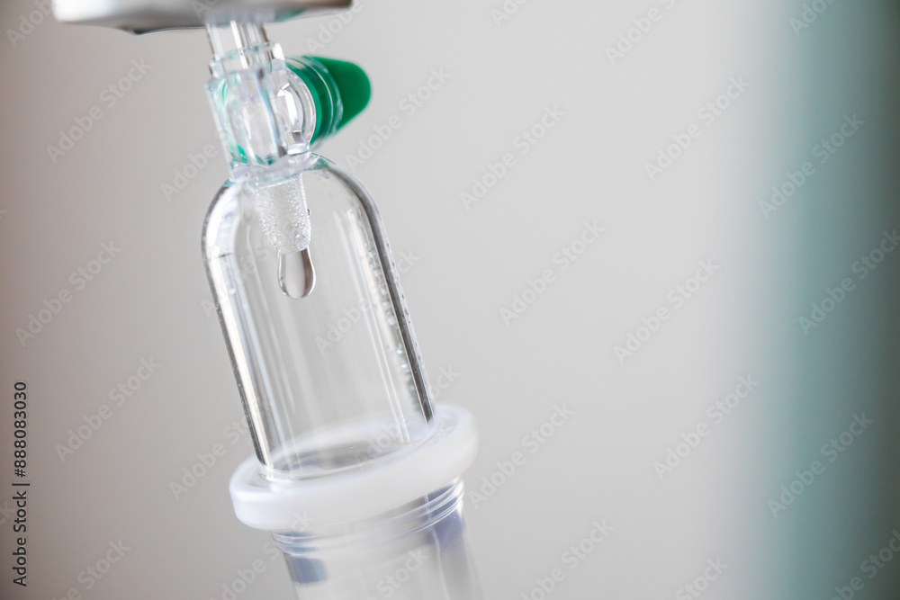 Close up medical intravenous IV drip in hospital background Close up medical intravenous IV drip in hospital background