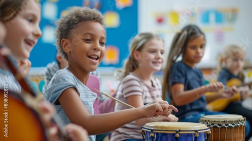 Diverse group of elementary school pupils enjoying a music lesson, playing drums and other instruments
