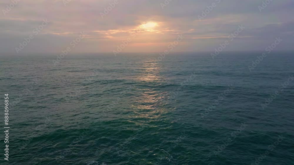 Cloudy evening sky ocean water rippling waving in slow motion. Marine horizon Cloudy evening sky ocean water rippling waving in slow motion. Marine horizon