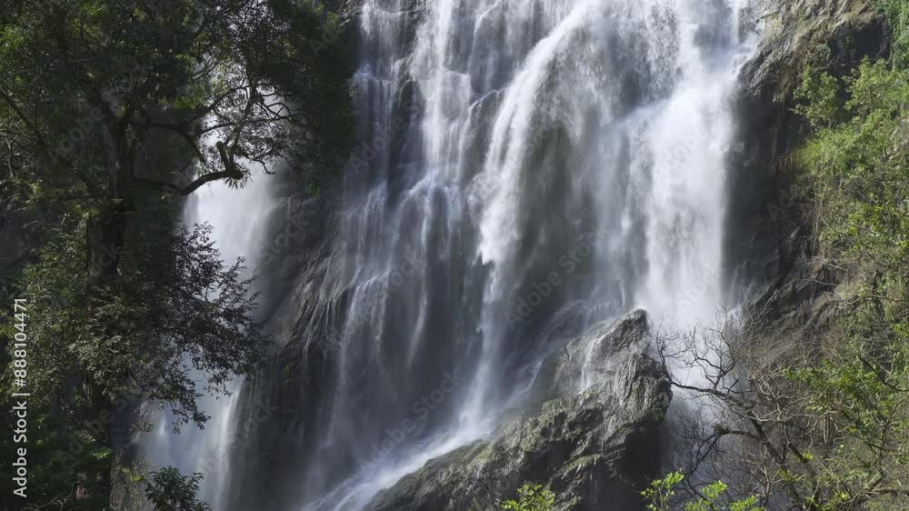Majestic Khlong Lan Waterfall at Khlong Lan National Park in Kamphaeng Phet, Thailand. A Stunning Natural Attraction and famous tourist destination. Majestic Khlong Lan Waterfall at Khlong Lan National Park in Kamphaeng Phet, Thailand. A Stunning Natural Attraction and famous tourist destination.