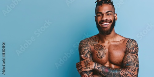 young friendly tattooed man, stylish, modern, solid background, copy space 