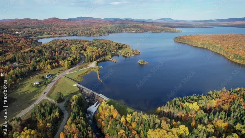 Water Flows Out of Northern New Hampshire Lake Thru Dam Autumn Water Flows Out of Northern New Hampshire Lake Thru Dam Autumn
