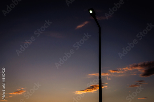 street lamp with dark blue sky background during hot summer evening 