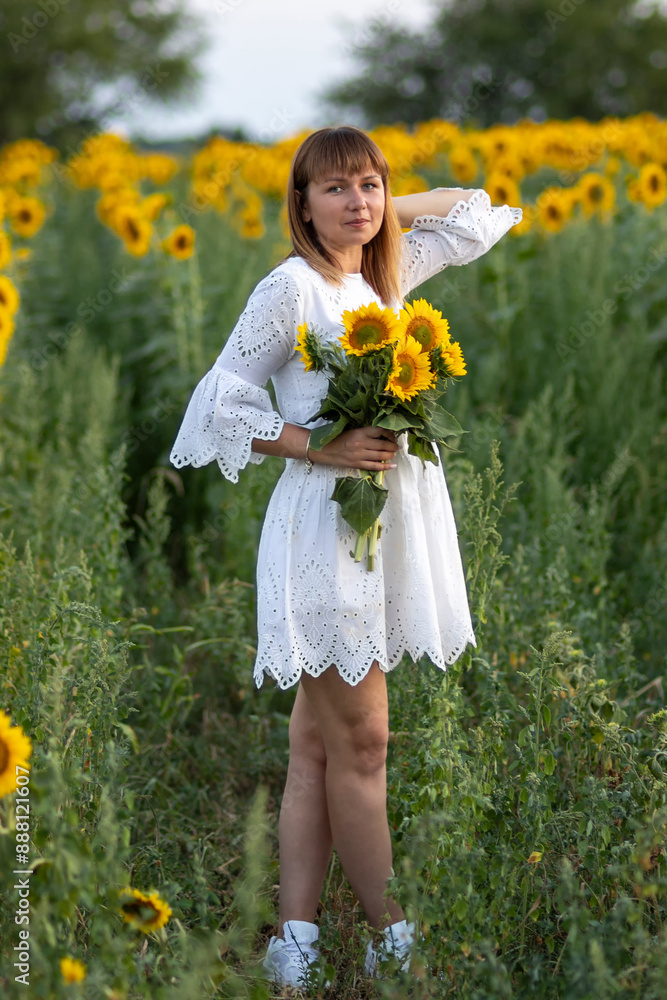 Beautiful young girl in a white dress with flowers Beautiful young girl in a white dress with flowers