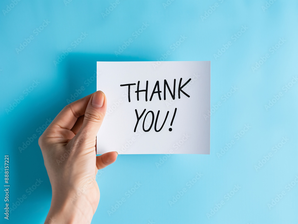 a hand holding a sign with black text a hand holding a sign with black text