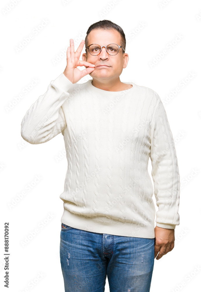 Middle age arab man wearing glasses over isolated background mouth and lips shut as zip with fingers. Secret and silent, taboo talking Middle age arab man wearing glasses over isolated background mouth and lips shut as zip with fingers. Secret and silent, taboo talking