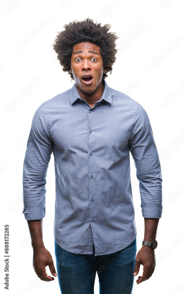 Afro american man over isolated background afraid and shocked with surprise expression, fear and excited face. Afro american man over isolated background afraid and shocked with surprise expression, fear and excited face.