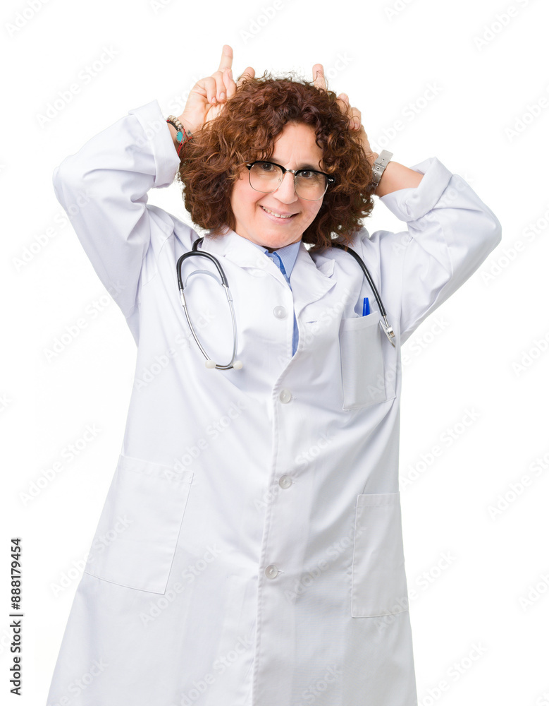 Middle ager senior doctor woman over isolated background Posing funny and crazy with fingers on head as bunny ears, smiling cheerful Middle ager senior doctor woman over isolated background Posing funny and crazy with fingers on head as bunny ears, smiling cheerful