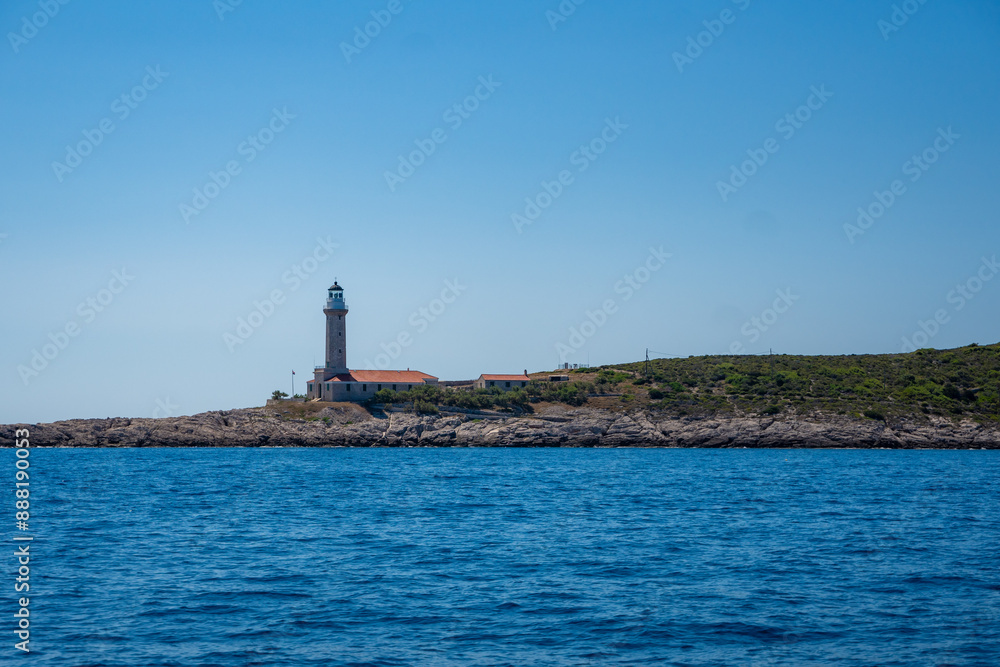 Lighthouse on shore near bay of Uvala Gradina near the town of Vela Luka on the island of Korcula, Croatia Lighthouse on shore near bay of Uvala Gradina near the town of Vela Luka on the island of Korcula, Croatia