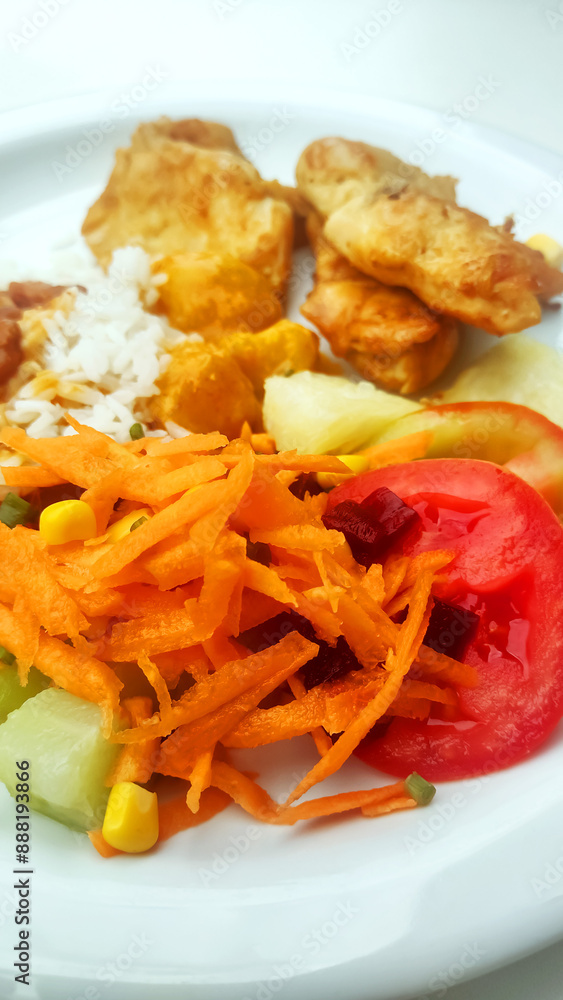 Vegetables on healthy traditional Brazilian meal named prato feito.
Vegetables on healthy traditional Brazilian meal named prato feito.