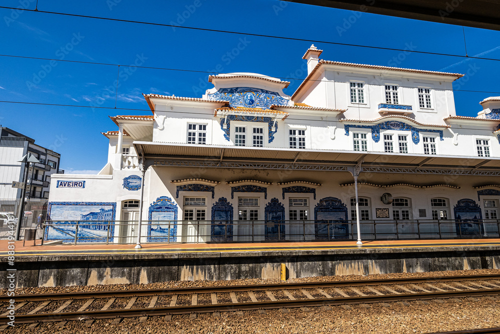 Historic building of old Aveiro Railway station ornamented with typical blue azulejos
