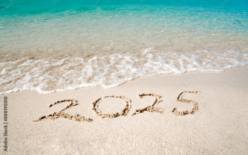 © Sergey - Top view of 2025 numbers written on the sand of coastline with frothy waves. 2025 new year concept.