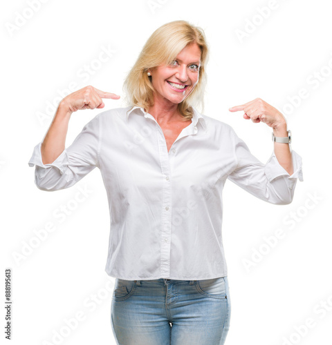 Middle age blonde business woman over isolated background looking confident with smile on face, pointing oneself with fingers proud and happy.