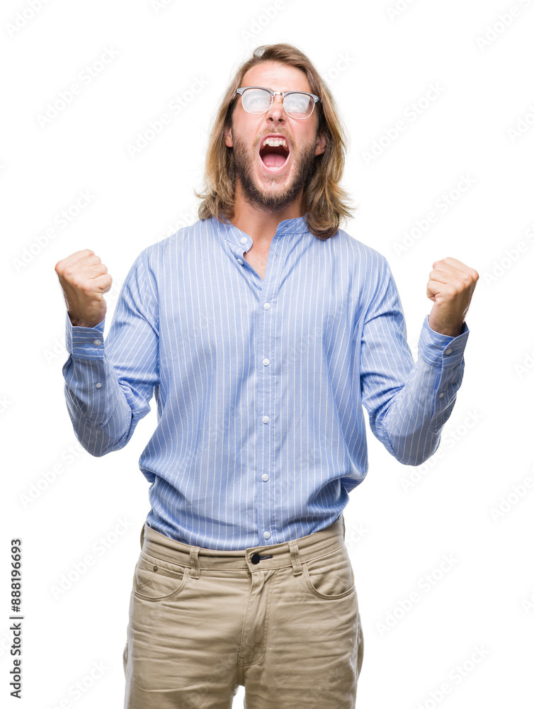 Young handsome man with long hair wearing glasses over isolated background crazy and mad shouting and yelling with aggressive expression and arms raised. Frustration concept. Young handsome man with long hair wearing glasses over isolated background crazy and mad shouting and yelling with aggressive expression and arms raised. Frustration concept.