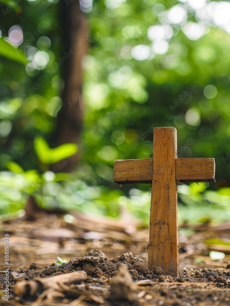 Wooden cross in nature surrounded by lush greenery and forest floor Wooden cross in nature surrounded by lush greenery and forest floor