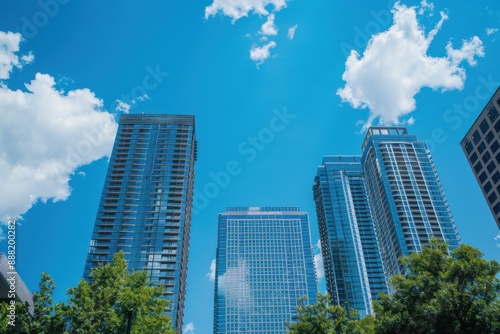 Skyline featuring four towering city buildings under a clear blue sky